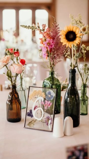 Table Number Flowers, Wild Flower Place Setting, Fall Wildflower Wedding Table, Colorful Wild Flower Wedding, Wildflower Wedding Centerpiece Boho, Wildflower Garden Wedding Theme, Wild Flower Table Decor, Centerpieces Wedding Photos, Wildflower Wedding Details