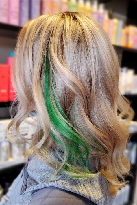 Blonde hair with a grass green streak. Blonde hair with green fashion color for Saint Patricks Day. #stpatricksdayhair Schedule an appointment at 724.256.9226 or online at https://www.primacapellisalon.com/book Prima Capelli Salon, Butler, PA. Dark Green Highlights In Blonde Hair, Blonde Hair Green Money Piece, Green On Blonde Hair, Blonde And Green Hair Peekaboo, Green Hair Streaks Blonde, Blond Hair With Green Highlights, Blond Green Hair, White Hair Colored Tips, Green Streaks In Blonde Hair