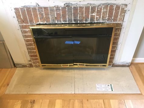 1/2" backer board was used to build a fireplace hearth that was level with the floor - The Handyman's Daughter Floor Level Fireplace Hearth, Raised Fireplace Hearth, Raised Fireplace, Fireplace Hearth Ideas, Fireplace Hearth Stone, Build Fireplace, Fireplace Hearth Tiles, Airstone Fireplace, Pellet Fireplace