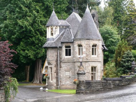 The castle-like house marks the entry to the 5 star Athol Palace Hotel. Tiny Castle, Magical Cottage, Small Castles, Castle Home, Storybook Homes, Storybook Cottage, English Manor, Casa Vintage, Gate House