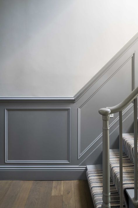 A staircase was updated with grey panelling and new carpet. Hallway Wall Colors, Terrace Home, Wall Molding Design, Stair Paneling, Gray Stairs, Entryway Stairs, Wall Moulding, Traditional Staircase, Van Der Straeten