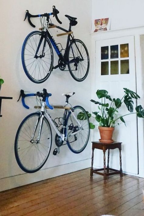 Maximize your small space with this sleek vertical bike storage solution! Perfect for keeping your bikes organized and off the floor. Dive into the post for more smart vertical storage tips! Storing Bikes In Apartment, Store Bike In Small Apartment, Bike Storage In Apartment, Small Apartment Bike Storage, Apartment Bike Storage, Bike Storage Ideas, Minimalist Bike, Bike Storage Apartment, Storage Solutions For Small Spaces