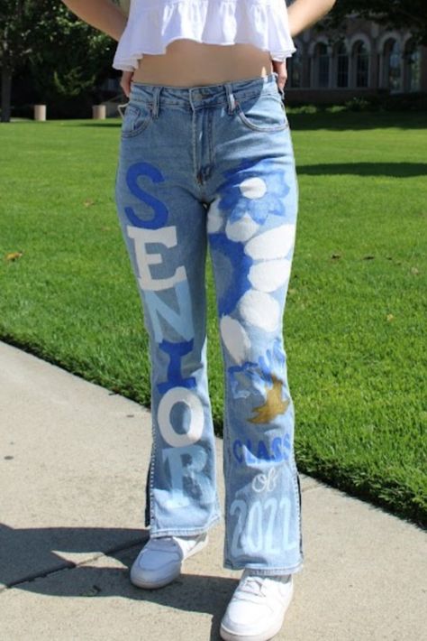 Senior Year Jeans 2024, Homecoming Jeans Junior, Senior Denim Jeans, Senior Jeans Cheer, Diy Decorated Jeans, Painted Jeans School Spirit Senior, Senior Pants Ideas High Schools, Decorated Jeans School Spirit, Senior Jeans 2024