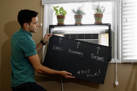 Cool tip to mask A/C unit  Sliding or magnetized covers incorporated into shelving or a credenza can hide the ugly, but indispensable, appliances.  http://www.latimes.com/home/la-hm-kyle-schuneman-20130810-story.html Window Ac Cover, Air Conditioner Hide, Air Conditioning Cover, Wall Air Conditioner, Ac Cover, Window Ac Unit, Hiding Ugly, Air Conditioner Covers, Air Conditioner Cover