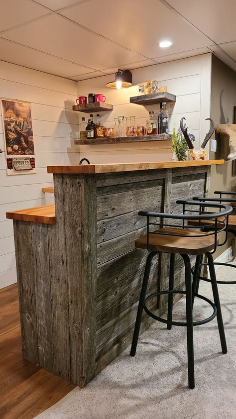 Rustic barnwood wet bar, shiplap walls, butcher block countertop, barnwood floating shelves Country Home Bar Ideas, Basement Wrap Around Bar Ideas, Man Cave Garage Wall Shelves, Reclaimed Wood Bar Ideas, Rustic Bar Basement, Wet Bar Counter, Kitchen Island Rustic Farmhouse, Cheap Basement Bar Ideas, Butcher Block Countertops Bar