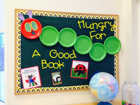 The Very Hungry Caterpillar bulletin board with paper plates from The Crafty Teacher Hungry Caterpillar Bulletin Board, Caterpillar Bulletin Board, Eric Carle Classroom, Book Bulletin Board, Door Bulletin Boards, Kindergarten Bulletin Boards, Library Bulletin Board, Reading Bulletin Boards, Spring Bulletin