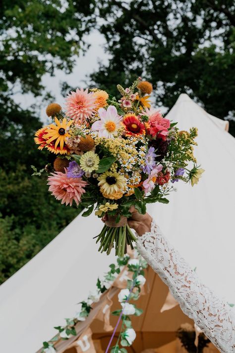 A bright joyful wedding bouquet full of colourful seasonal British grown September flowers. Perfect for a relaxed festival style wedding! Designed and created by @bryonymaeflowers Photography by @LaurenBethPhotography Please click on photo to see more. #festivalwedding #brightweddingbouquet #britishflowers #colourfulwedding #sussexflorist Wildflower Style Wedding Bouquet, Wild Flower Backyard Wedding, Fresh Wildflower Bouquet, Colourful Wildflower Wedding, Multicolour Wedding Flowers, September Wedding Flowers Uk, Flowers September Wedding, Wedding Colourful Flowers, Bright Bridal Flowers