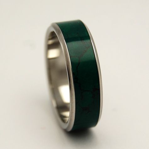 Glowing green wonder. Imperial Jade is centered between two flared titanium edges. In gemstone therapy it is said that jade 'stimulates creativity and mental agility', while also having a balancing an Glow Rings, Pretty Wedding Rings, Tangled Wedding, Bridesmaid Stuff, Vowel Renewal, Imperial Jade, Titanium Wedding Rings, Rings Unique, Titanium Ring