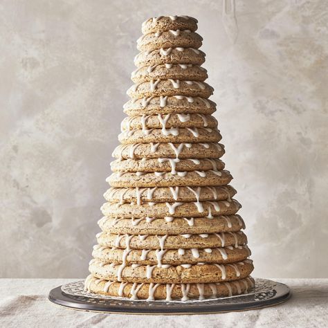 Kransekake (Norwegian Almond Ring Cake) Norwegian Deserts, Norwegian Kransekake, Kransekake Recipe, Almond Ring, Norwegian Cookies, Poured Icing, Norwegian Culture, Norwegian Recipes, Cake Almond