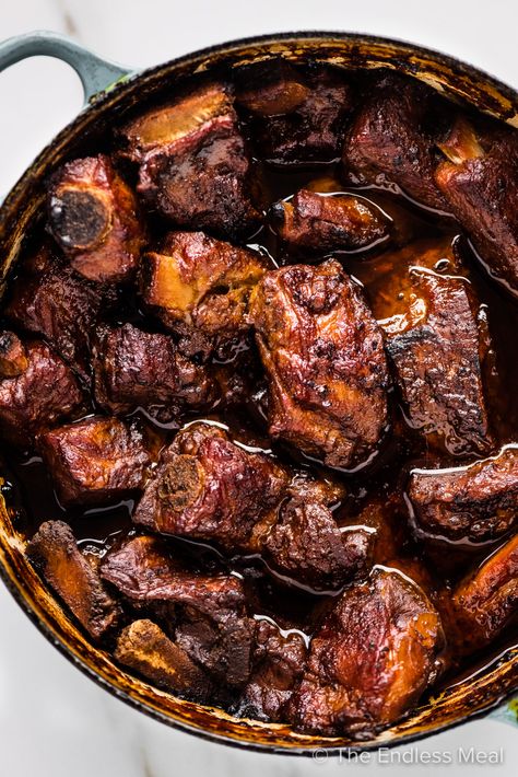 These braised pork ribs are as good as it gets. They're slow-cooked in a ridiculously delicious sauce made with dark beer and chocolate that, by the time the ribs have finished cooking, becomes the best gravy you'll ever try. #theendlessmeal #braisedporkribs #braisedribs #ribs #porkribs #braised #slowcookedribs #dinner #pork Pork Rib Stew Recipe, Tomahawk Pork Chop Recipe, Braised Ribs, Braised Pork Ribs, Dinner Pork, Slow Cooked Ribs, Slow Cooked Pork, Baked Ribs, New Years Eve Dinner