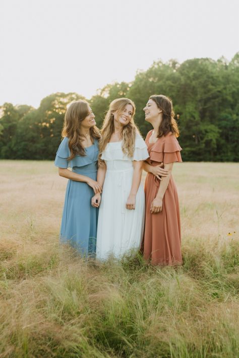 Three sisters laughing together during a photoshoot. 3 Bff Photoshoot, Four Sister Photography Poses, 3 Friend Poses Photography, 3 Sister Photoshoot Poses Photo Ideas, Cousin Photoshoot Ideas Adults, Grown Sister Photo Shoot, 3 Sister Photoshoot Poses, Trio Professional Photoshoot, Mom And Sisters Photoshoot