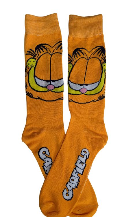 Everyone's favorite cartoon cat, Garfield, smiles widely on these character socks. They are machine washable and made out of 97% Polyester and 3% Spandex for a comfortable stretch when you have nothing to do. Officially licensed Nickelodeon merchandise and a perfect gift for the lasagna lover in your life. Garfield Socks, Garfield Clothes, Garfield Things, Dog Cartoon Character, Fat Orange Cat, Garfield Pictures, Garfield Images, Garfield Cartoon, Garfield Cat