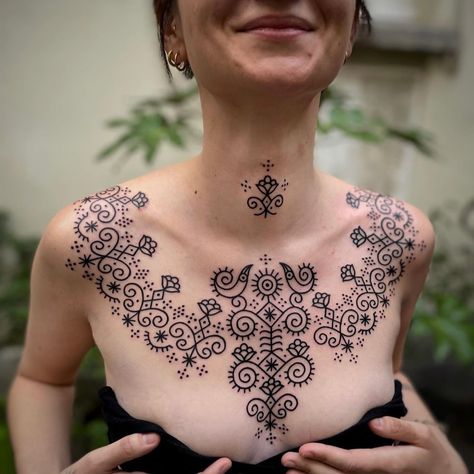 Folk Art Chest Tattoo, Folk Chest Tattoo, Rajasthani Tattoo, Norwegian Flower Tattoo, Dot Work Neck Tattoo, Quirky Tattoos For Women, Eastern European Tattoos, Ornament Chest Tattoo, Ornamental Chest Tattoo Female