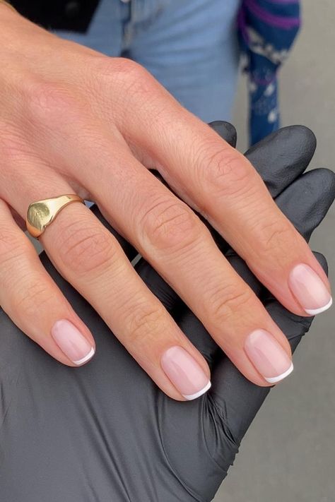 Embrace timeless elegance with a classic French manicure on short, natural square nails. The subtle pink base and crisp white tips exude sophistication and simplicity, creating a perfectly chic and polished look. // Photo Credit: Instagram @fayelouisedennis This French Tip Nails, French Nails In Short Nails, White Short Nails French Tip, French Tip Vs American Tip Nails, Classic Short Nail Designs, French Nails Round Square, Extra Short Nails French Tip, Elegant Nails Classy French Tips Short, French Nail Manicure