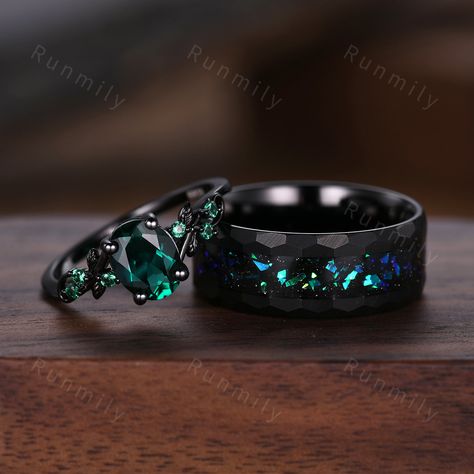 Here we have a Oval cut emerald couples ring set black gold matching promise ring His and Her wedding band Mens hammered tungsten ring anniversary gifts ITEM DESCRIPTION ✦ Handmade, high-quality item! ✦ Material: Sterling Silver/Solid Gold/Tungsten ►Sold as a two-piece set ►His ring is Black Tungsten Carbide with blue green opal. ►His band width: 8mm ►His tungsten ring will not turn green itself and will not cause your skin to turn green.  ✦ Durable - Incredibly Scratch-Resistant to always look Engagement Rings Men And Women, Ring Sets Wedding His And Hers, Wedding Rings Sets His And Hers Black, Green And Black Wedding Ring, Cool Wedding Rings For Men, Goth Wedding Rings Men, Black And Green Engagement Ring, Magical Wedding Rings, Alt Wedding Rings