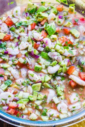 Ceviche is loaded with shrimp, avocados, tomatoes and cucumbers; all marinated in fresh lime juice. You can use cooked or raw shrimp in this Mexican shrimp cocktail. #ceviche #cevicherecipe #shrimpceviche #howtomakeceviche #mexicanceviche #appetizer #salsa #shrimp #avocado How To Make Shrimp Ceviche, Ceviche Shrimp Recipe, Cevechi Recipe, Shrimp Ceviche Recipe Mexican Authentic, Shrimp Cerviche, Seafood Ceviche Recipe, Civeche Recipe, Ceviche Cocktail, Fish Ceviche Recipe