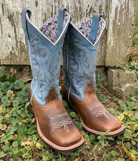 Style number: 5895. Blue leather upper. Tan leather foot. Pull on tabs. Western embroidery on shaft. 11 inch shaft height. White piping. Square toe shape. Removable ortholite insole. Cowboy approved II outsole. Stockman heel type. 1 1/2 inch heel height. Flat Toe Boots, Laredo Boots Women, Tony Lomas Boots, Women’s Square Toe Cowboy Boots, Square Toed Cowgirl Boots, Ariat Boots Square Toe, Western Wedding Boots, Western Heels, Square Toe Cowgirl Boots