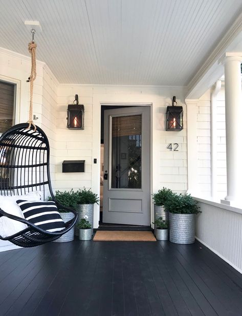 We painted our pink door gray! Come see what else we did for curb appeal. #mostlovelythings #graydoor #curbappeal #entryway #porch #hangingchair #planters #outdoorlighting #outdoorsconces Industrial Front Porch Ideas, Black Porch Ideas, Craftsman Front Porch Ideas, Rustic Farmhouse Front Porches, Craftsman Front Porch, Black Porch, Farmhouse Front Porch Decorating, Breezeway Ideas, Modern Front Porches