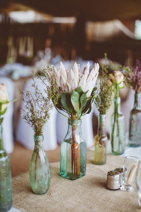 How to Create those Stunning Handmade Wedding Table Decorations - Get floral | CHWV Protea Wedding, Protea Bouquet, Deco Champetre, Tafel Decor, Eco Wedding, Sustainable Wedding, Rustic Wedding Centerpieces, Eco Friendly Wedding, Wedding Table Decorations