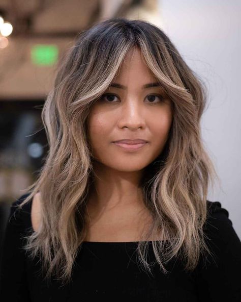 23 Flattering Ways to Pair Curtain Bangs with Wavy Hair Curtain Bangs Baylage, Bangs With A Money Piece, Money Pieces And Curtain Bangs, Curtain Bangs Medium Hair Money Piece, Money Piece With Short Bangs, Curtain Bangs Ombre Hair, Curtain Bangs For Fine Wavy Hair, Money Piece Short Bangs, Money Piece Bangs Balayage