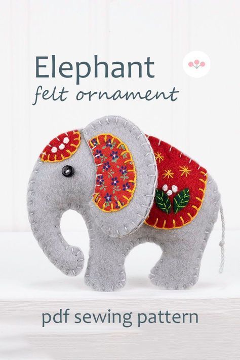 Sew your own Ella the Elephant, an embroidered felt elephant ornament.Ella measures 8cm / 3.5 inches high and has a cotton loop for hanging.The pattern includes detailed instructions and step by step photos, with actual size templates.All the stitching is done by hand - you don't need a sewing machine.#feltornaments #handmadechristmasornaments Felt Elephant, Diy Felt Christmas Ornaments, Felt Ornaments Patterns, Felt Animal Patterns, Felt Crafts Patterns, Felt Crafts Christmas, Elephant Ornament, Felt Crafts Diy, Felt Ideas