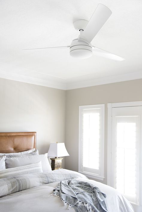 I'm sharing a giant roundup of my favorite white ceiling fans on the blog today. I've also got tips for making them feel more intentional in your design plan and home. Ceiling Fan White Bedroom, Ceiling Fan White With Light, Modern Bedroom With Ceiling Fan, Boho Ceiling Fan With Light Bedroom, Interior Design Ceiling Fan, White Ceiling Fan No Light, Ceiling Fan Master Bed, Ceiling Fan Girls Room, White Ceiling Fan Bedroom