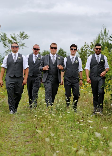 The groom and groomsmen adorned grey tuxes. The groom wore the full tux while the groomsmen rocked a more casual look with no jacket and rolled up sleeves. #rustic #country #diy #wedding #summerwedding #countrywedding #rusticwedding #diywedding Grey Tux, Rolled Up Sleeves, Country Diy, Groom Wear, Roll Up Sleeves, Groom And Groomsmen, The Groom, Rustic Country, Country Wedding