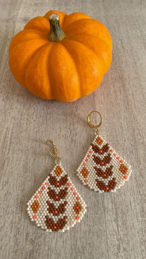 This listing is for a digital pattern of my original diamond brick stitch beaded earring pattern called Crunchy Leaves. Your purchase does NOT include instructions or supplies, but you can find tutorials for Brick Stitch on ton my YouTube channel, https://www.youtube.com/@snailsandfairydust The finished size of one earring is 1.25 x 1.5 inches, and this pattern was designed for size 11 Miyuki Delica seed beads, which is what I recommend for best results. However, if you use different beads, please note that the sizing will vary. With your purchase, you will receive a 3 Page PDF with a visual beading chart, a word chart, supply list and the exact bead count needed as well as the product numbers for the specific size 11 Delica beads used in the design. I can't wait to see what you create. Ha Seed Bead Diamond Pattern, Thanksgiving Seed Bead Earrings, Halloween Brick Stitch Earrings, Fall Seed Bead Earrings, Fall Beaded Earrings, Brick Stitch Earrings Tutorial, Seed Bead Earrings Tutorial, Bead Weaving Patterns Free, Beaded Brick Stitch