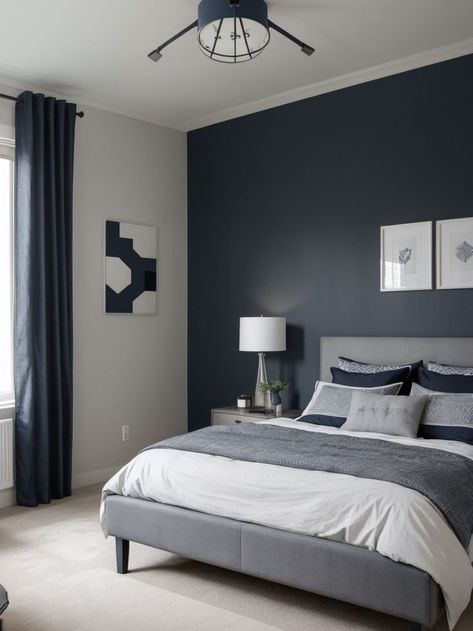 Create a stylish and sophisticated boys bedroom with a combination of grey and navy. Use a navy blue accent wall as a focal point, complemented by grey bedding and curtains for a modern and masculine look. Complete the design with industrial-style light fixtures and geometric patterns for added visual interest. Blue Teen Bedrooms, Navy Blue Accent Wall, Grey Boys Rooms, Navy Blue Rooms, Boys Bedroom Curtains, Blue Accent Wall, Navy Inspiration, Blue Gray Bedroom, Gray Bedroom Walls