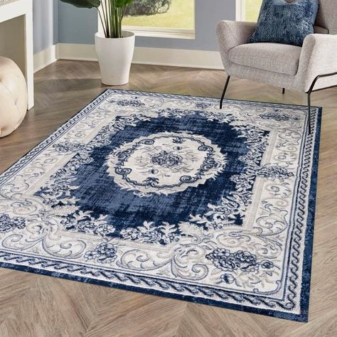 This ornate medallion rug has a scroll and floral pattern, adding modern Bohemian cottage style to a living room, bedroom, entry or kitchen. Varied tones of denim blue on an ivory background give this rug a hand-woven, rustic look. Cabin Rugs, Blue And White Wallpaper, Grey Curly Hair, Medallion Area Rug, Bohemian Cottage, Blue And White Decor, Modern Outdoor Lighting, Blue Toile, Contemporary Cottage