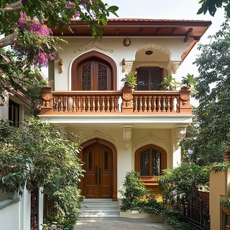 Step into a world where tradition meets modernity! 🏡✨ This 2-floor duplex blends cultural heritage with contemporary charm. From intricate railings to vibrant terracotta accents, every detail tells a story. Surrounded by lush greenery, it's a haven of warmth and elegance. ☀️🌿 #ArchitecturalDesign #IndianArchitecture #HeritageHomes #DuplexHouse #HomeDesign #ModernTraditional #InteriorDesign #HomeInspiration Terracotta Accents, Duplex House, Indian Architecture, Lush Greenery, Modern Traditional, Cultural Heritage, 2nd Floor, A World, Lush