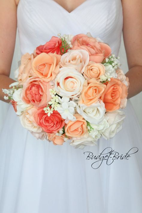 This is a round brides bouquet with a mixture of coral, peach and beige roses accented with babies breath. All of our wedding bouquets are made with artificial wedding flowers. Coral Wedding Themes, Coral Wedding Flowers, Peach Bouquet, Peach Wedding Flowers, Vintage Wedding Flowers, Cheap Wedding Flowers, Rosa Coral, Brides Bouquet, Babies Breath