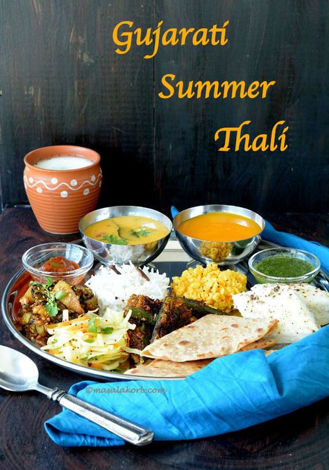 Gujarati Summer Thali includes traditional food recipes along with fresh mango pulp (aamras), which is an integral part of the meal during summer season. Gujrati Thali Recipes, Gujarati Thali Recipe, Thali Ideas, Traditional Food Recipes, Lunch Menu Ideas, Gujarati Thali, Indian Thali, Gujarati Cuisine, Indian Food Photography