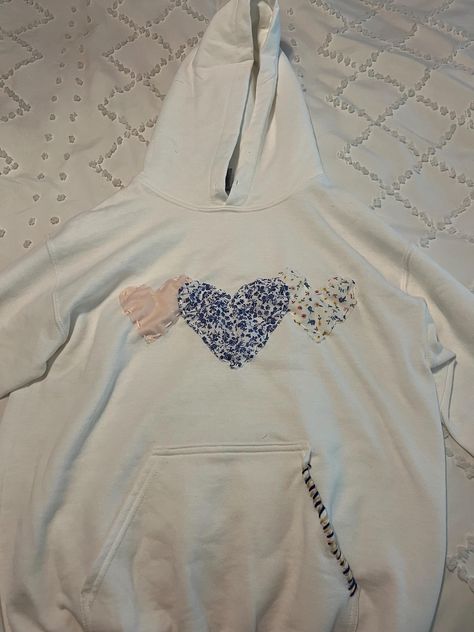 Heart Sewn Hoodie | This sweatshirt comes with multiple, customizable colors and fabrics and is sewn by hand. Because each sweatshirt is handmade, no two sweatshirts are alike. Custom stitching is also chosen by designer to match fabric. Cute Best Friend Matching Outfits, Diy Hoodie Iron On Ideas, Stitch Work Hoodie, Hobby Lobby Hoodie Diy, Fabric Sweatshirt Design, How Lucky Are We Sweatshirt, How Lucky Are We Hoodie, Hobby Lobby Sweatshirt Ideas, Heart Patch Hoodie