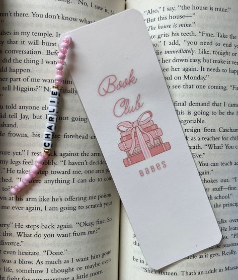 A great personalized gift for yourself or other members in your book club! You can choose from no charm, or an added personalized charm.  All my bookmarks are printed on cardstock paper, cut, and laminated for extra durability! Add the charm for an extra special touch!  Size measures ~2" w x 6"h This personalized charm comes with pink beads. Thank you for the support!  -Libro Lovers! Bookmark Charms Diy, Book Club Bookmarks, Bead Bookmarks, Pink Bookmark, Library Bookmarks, Personalized Book, Custom Bookmarks, Bookclub Gifts, Personalized Bookmarks