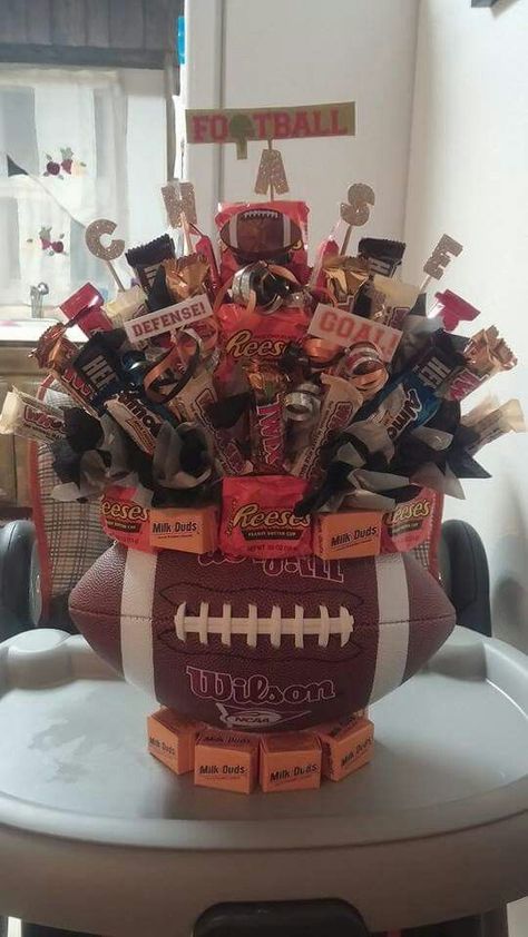 Football Candy Bouquet Soccer Candy Bouquet, Football Auction Basket Ideas, Soccer Raffle Basket Ideas, Graduation Candy Bouquet Ideas, Homecoming Baskets For Football Players, Football Game Basket Ideas, Football Raffle Basket, Homecoming Baskets Football, Football Raffle Basket Ideas