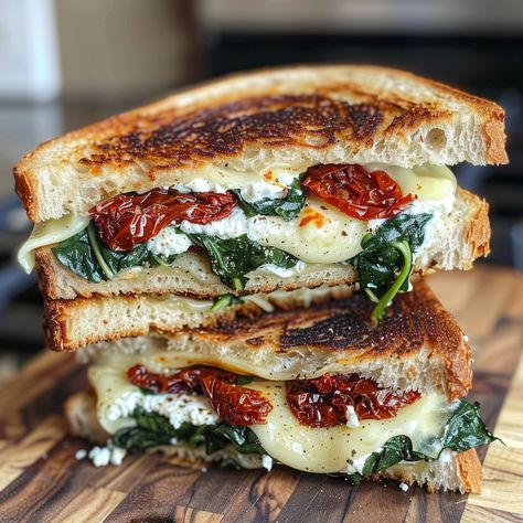 Let's be honest - is there anything more comforting and nostalgic than a classic grilled cheese sandwich? That first hot, crispy bite transports you right back to childhood. But as amazing as the original is, Spinach Dip Sandwich, Tuscan Grilled Cheese, Sun Dried Tomato Spinach Grilled Cheese, Apple Chicken Sandwich, Ricotta Cheese Sandwich, Ricotta Grilled Cheese Sandwiches, Ciabatta Grilled Cheese, Grilled Tomato Sandwich, Sandwich Toaster Recipes