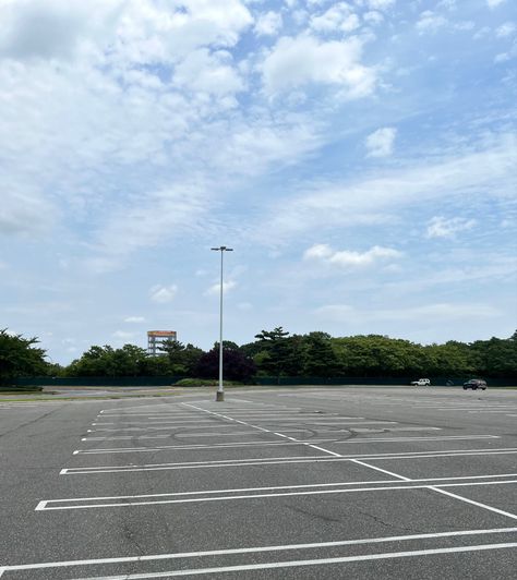 Almost empty parking lot with cloudy sky. Parking Lot Background, Sky Scape, Suburban Gothic, Empty Parking Lot, Miss Tennessee, Background References, School Background, Car Lot, Parking Space