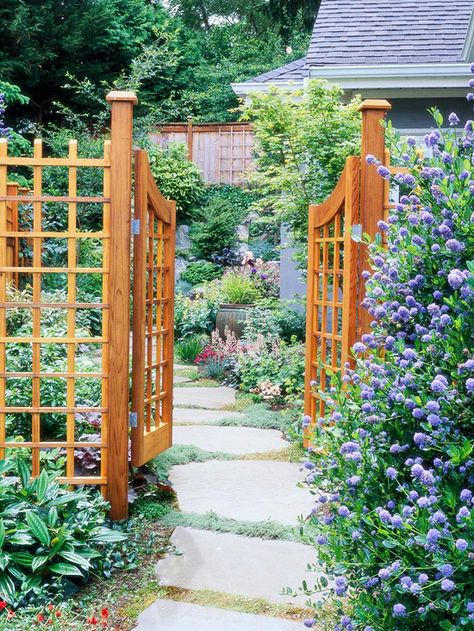 An easygoing path leads the way to a welcoming garden oasis: http://www.bhg.com/gardening/landscaping-projects/landscape-basics/path-and-walkway-landscaping-ideas/?socsrc=bhgpin052414gardengate&page=1 Gate Arbor, Garden Arbor With Gate, Garden Gate Design, Walkway Landscaping, Sloped Garden, Garden Arbor, Wooden Gates, Pergola Plans, Garden Oasis