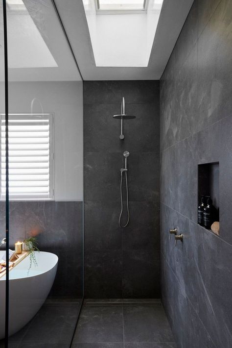 A dark grey moody bathroom from Luke and Josh on this year's Block series. Grey Primary Bathroom, Dark Grey Ensuite, Dark Grey Floor Tiles Bathroom, Gray Stone Shower Ideas, Bathroom Dark Grey Tiles, Bathroom Ideas Dark Grey Tiles, Moody Ensuite Bathroom Ideas, Dark Grey Tiled Bathroom, Dark Grey Shower Tile Bathroom