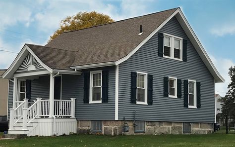 This New Bedford, MA home looks stunning with a new AZEK Porch and Mastic Carvedwood 44 Vinyl Siding in the color, English Wedgewood. When the time comes to update your home, you can trust Care Free Homes to provide professional products, quality workmanship, and reliable customer service. Don’t postpone your project! Get a free quote by calling (508) 997-1111. Make your house a Care Free Home. #NewBedfordMA #Contractor #VinylSiding #AZEKDecking #porch #replacementwindows #roofing House Vinyl Siding Ideas Exterior, Blue Grey Exterior House Colors, Siding House Exterior, Vynil Siding, House Siding Ideas Exterior, Mastic Vinyl Siding, Mastic Siding, Grey Vinyl Siding, Outdoor Siding