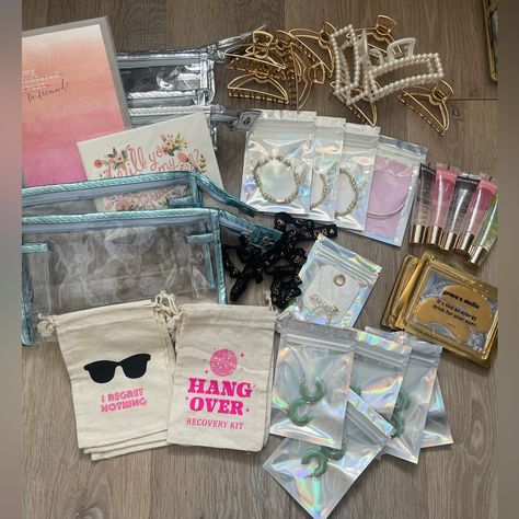 All Brand New Bridesmaid/Bachelorette Items For Asking Your Bridesmaids, Wedding Morning, Or Bach Goodie Bags! This Will Give You A Great Head Start On Gifts! The Listing Includes: 6 Hangover Pouches To Be Filled With Goodies Of Your Choice 1 Moh Bracelet With Card 3 Gold Beaded Bracelets 10 Bride Tribe Hair Ties 5 Sets Of Under Eye Gels 10 Claw Clips - 2 Pearl And 8 Gold Metal 2 Unopened Bridesmaids Cards From Rifle Paper Co 5 Pairs Of Jade Colored Hoops + 1 Pair Of Pearl Hoops 5 Lip Oils 6 Cle Bachelorette Gifts For Bridesmaids Beach, Bridesmaid Bachelorette Gift Bags, Bachelorette Gifts For The Bride Baskets, 21st Birthday Goodie Bags, Bachelorette Bag Ideas, Bridesmaid Bachelorette Gifts, Goody Bags For Adults, Day Of Bridesmaid Gifts, Day Of Wedding Bridesmaid Gifts