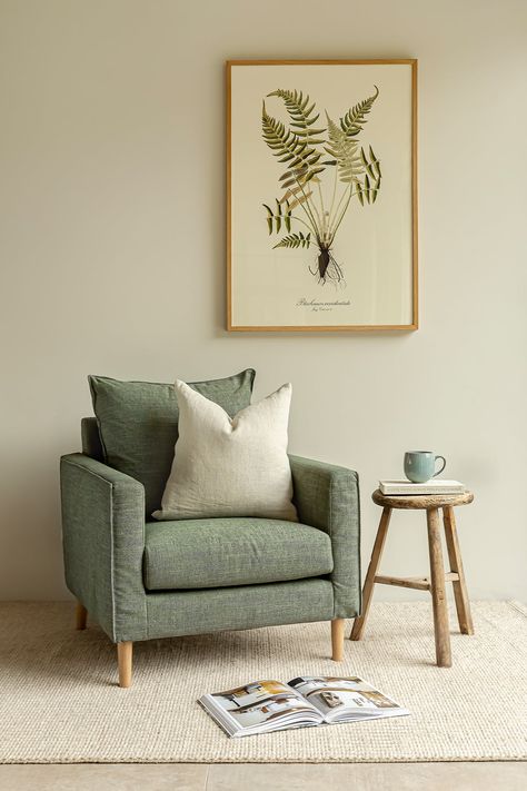 With an elegant yet modern shape and sumptuous pure linen upholstery, our luxurious Moreton armchair is all you need to create a comfortable and inviting living area at home. Its stunning design has clean, simple lines and a wonderfully deep seat that is perfect for sinking into. Not The Colour You Are Looking For? Our Moreton armchair is also available in a variety of made-to-order colours and fabrics. Get in touch with our friendly team to find out more, request fabric samples and to purchase Grey Sofa Green Cushion, Backsälen Chair, Arm Chairs In Kitchen, Cosy Home Design, Sage Sofa Living Room, Sofa Colour Ideas, Armchair Styling, Green Armchair Living Room, Living Room Green Accents