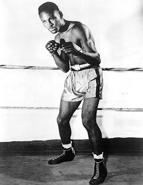 Ezzard Charles flattened knockout king Archie Moore #OnThisDay in 1948 http://www.boxingnewsonline.net/on-this-day-ezzard-charles-flattens-knockout-king-archie-moore-in-1948/ #boxing Archie Moore, Rodeo Rider, Heavyweight Boxing, George Sand, Boxing Champions, Boxing Shorts, National Portrait Gallery, Mma Fighters, Portrait Gallery