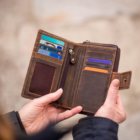 The wallet made of brown vintage genuine leather is extremely durable and robust. 
The wallet has: 1 note compartment, 1 coin compartment and 10 card slots inside.

. The integrated RFID protection ensures extra security.
——
Each piece is unique

——
Genuine buffalo leather with double stitching
——
The wallet is made of pleasantly non-slip vintage buffalo leather. The leather is natural, oiled (vegetable oil) and sanded. This means the wallet darkens over time and gets a great patina look.
——
So Buffalo Leather, Womens Purses, Vegetable Oil, Medium Size, Card Slots, Boho Fashion, Patina, Coin, Genuine Leather