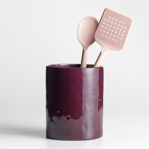 Made to complement our coveted Marin collection, this charming utensil holder exhibits the same organic lines and artisan appeal. Subtly textured stoneware gets a dip in deep wine-red glaze that's glossy and bold. We love the rich color this vessel brings to the stove or countertop, especially filled with the coordinating pink utensils for a modern, tonal look.   • Glazed stoneware  • Dishwasher-safe  • Imported Marin Merlot Red Stoneware Utensil Holder Ceramic Wine Bottle Holder, Red Ceramic Bowl, Mexican Modern Kitchen Decor, Kitchen Wares Products, Ny Lifestyle, Ceramic Kitchen Utensil Holder, Pink Utensils, Boston Living, Apartment Paris