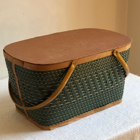 Delightful vintage picnic basket with a lovely forest green exterior weave together with natural earth tones. This basket is in excellent vintage condition being structurally sound and sturdy with metal hinges and handles. Great for storage or displays and also sturdy enough for today's picnic at the park! Decorating With Vintage Picnic Baskets, Vintage Picnic Basket Decor, Green Picnic Basket, Picnic Basket Decor, Perfect Picnic Basket, Family Heirloom Display, Spell Cards, Boo Baskets, Vintage Picnic Basket