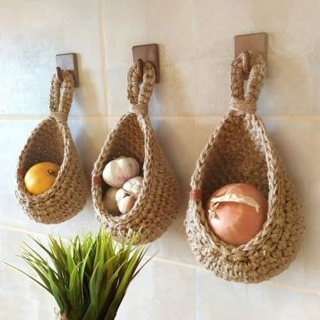 Description: Hand-woven from high quality materials, this hanging basket stores vegetables and fruit and the basket is well ventilated for long storage. Featuring a special teardrop shape, this hanging basket is very decorative and can be matched with most decorative styles, adding a touch of natural charm to your home and is very eye-catching. It is made of high quality braid fabric material. There are 6 different sizes for you to choose. This wall baskets are perfect for onions, garlic, potatoes or fruit. Item Name: Hanging Basket Material: Braid Fabric Feature: Creative, Eco-friendly, Multipurpose Size Details: Size A: 14cm x 21.5cm x 11.5cm/5.51" x 8.46" x 4.53" (Approx.) Size B: 16cm x 23cm x 11.5cm/6.3" x 9.06" x 4.53" (Approx.) Size C: 18cm x 24cm x 13cm/7.09" x 9.45" x 5.12" (Appro Onion Storage, Hanging Wall Baskets, Small Pantry Organization, Hanging Fruit Baskets, Jute Hanging, Rustic Kitchen Decor, Handmade Kitchens, Decoration Inspiration, Hanging Basket