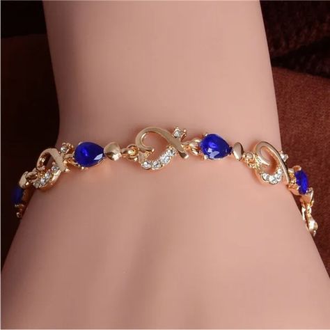 Gold Plated Blue Cubic Zirconia & Hearts Bracelet. Blue Color Is A Lighter Blue Shade In Person Than Photos. Measures 8” Inches. New Condition And Comes In A Gift Box. Bundle & Save: Bundle 2 Or More Items For A Private Discount Next Day Shipping On All Orders 5 Star Rated Poshmark Ambassador Crystal Fashion, Wedding Party Jewelry, Heart Chain, Elegant Bracelet, Crystal Charm, Bangles Jewelry, Blue Bracelet, Austrian Crystal, Crystal Heart