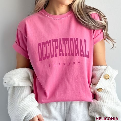 This Occupational Therapy Shirt / OT Shirt makes the perfect gift for the Occupational Therapist in your life - or buy it for yourself! You will not be sorry you did! Comfort Colors Shirts are so comfy and cute, it will be sure to be a favorite!  **UNISEX SIZING**  ♥ W E L C O M E  T O  S K E T C H Y  C A T  D E S I G N S ! ♥ * This is a standard unisex garment-dyed 100% cotton shirt - Comfort Colors Tee with a relaxed fit. FOR AND OVERSIZED TEE, PLEASE SIZE UP!!  Please review the size chart to Occupational Therapy Shirt, Therapist Outfit, Occupational Therapist Gifts, Occupational Therapy Gifts, Occupational Therapy Shirts, Occupational Therapist, Comfort Colors Shirt, Comfort Colors Tee, Occupational Therapy